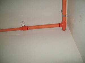 These ugly, exposed pipes were a bathroom disaster