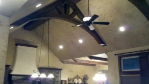 By adding a faux wood truss to her ceiling design, kelly was able to update and beautify the entire space.