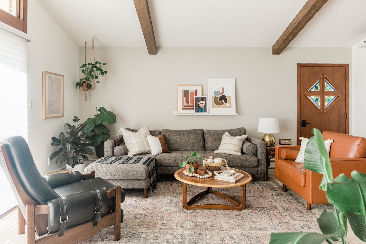 Boho chic style living room utilizing caramel colored driftwood faux wood beams