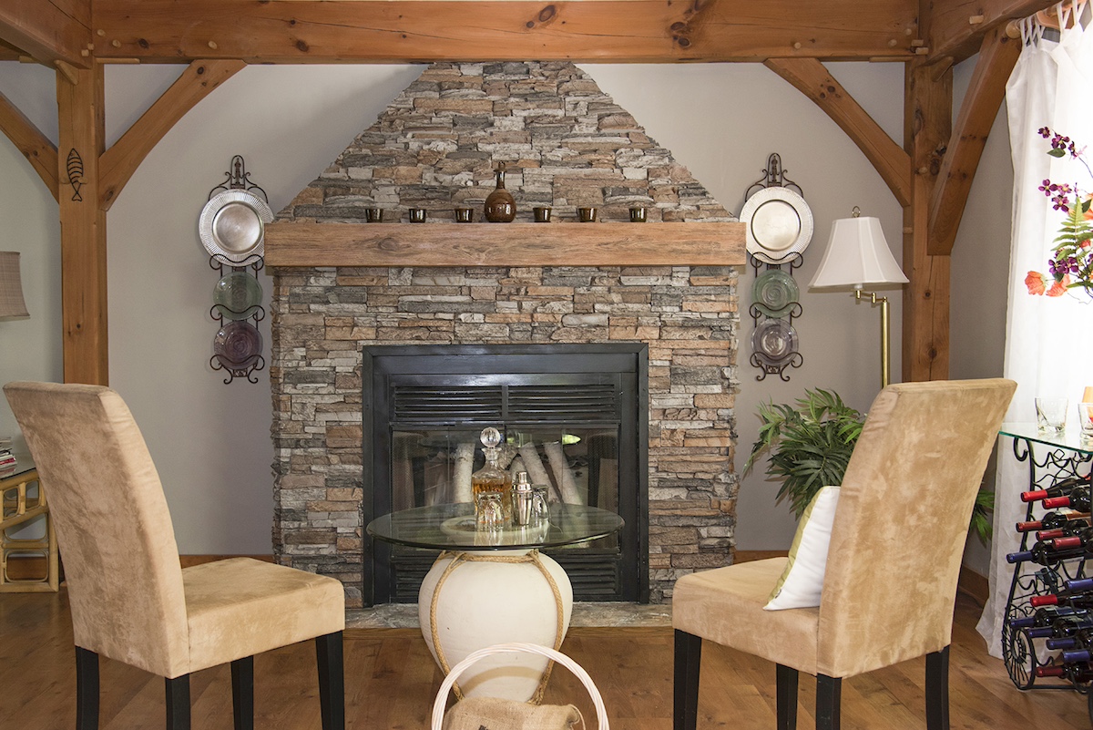 Driftwood Faux Wood Mantel in Early American on a fireplace in a rustic room