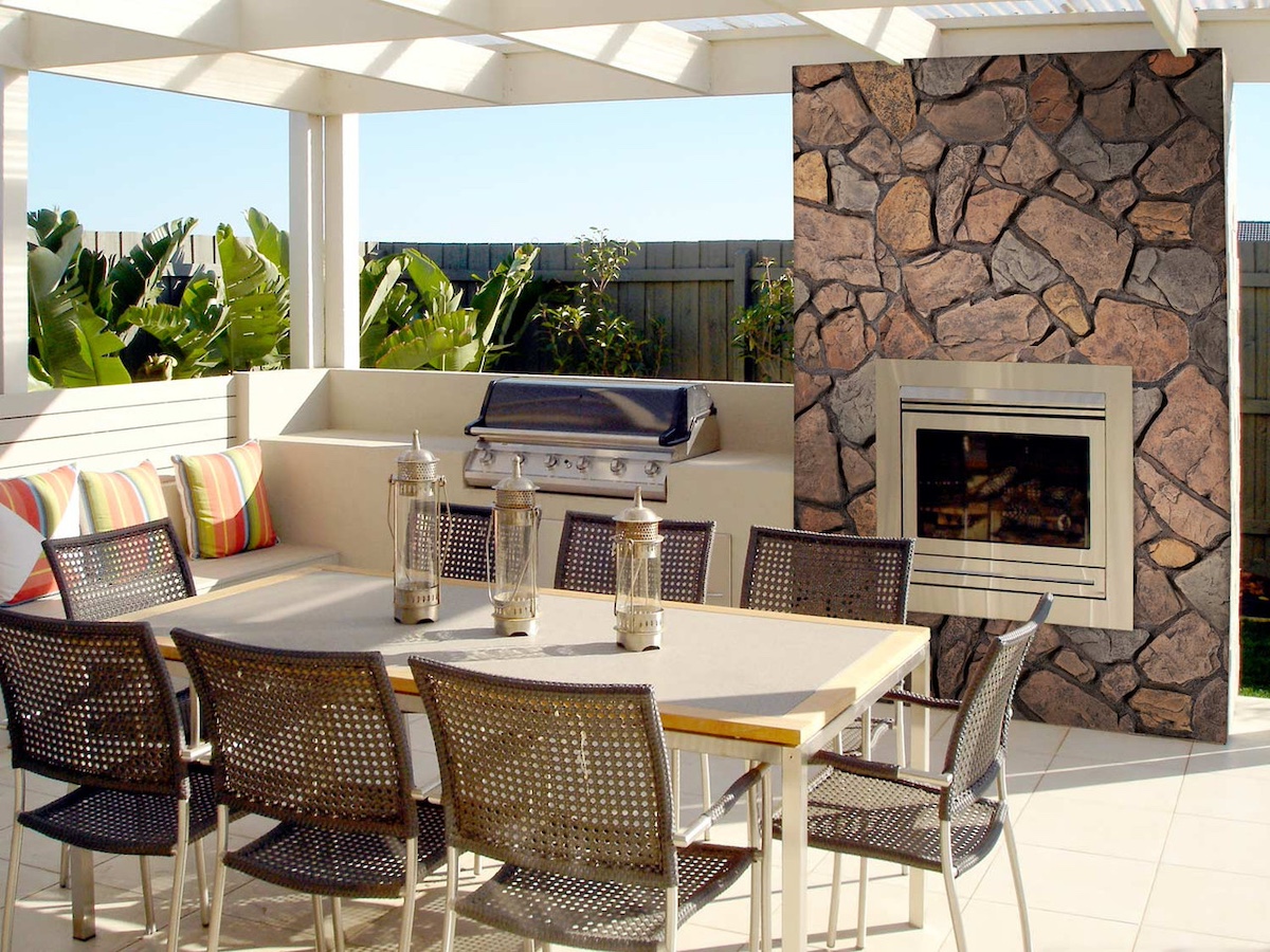  Anson Fieldstone Faux Stone Wall Panel in Earth used for a back patio fireplace