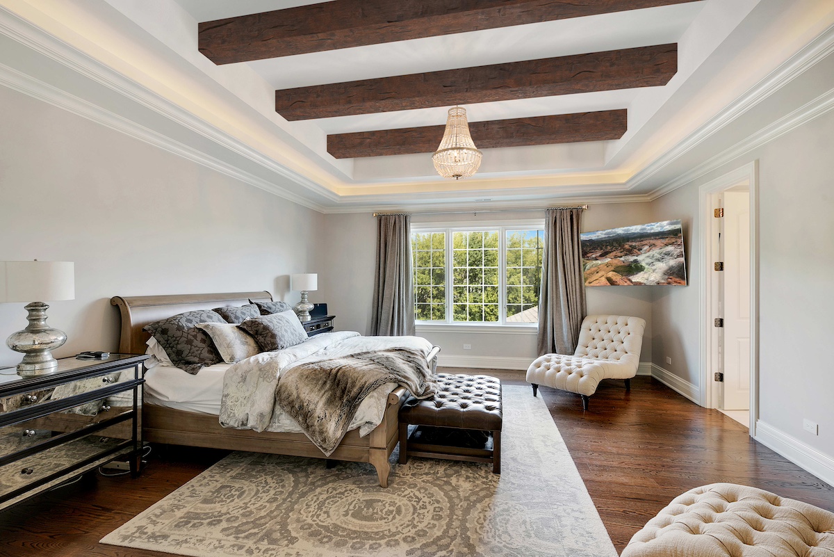 Hand Hewn Faux Wood Beams in Dark Walnut decorating an AirBnb bedroom